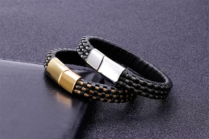 Detail of men's braided leather bracelets with gold and silver magnetic metal clasps