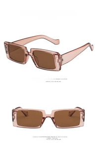 Vertical view of retro rectangular sunglasses in transparent brown frame and lenses