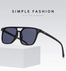 Detailed view of square black frames with blue lenses and retro double bridge design