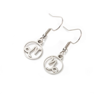 Polished stainless steel hoop earrings featuring a cutout Capricorn zodiac symbol design