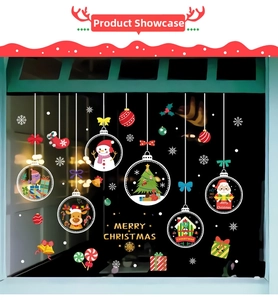 Christmas window decals showing Santa, reindeer and snowman on a night glass pane