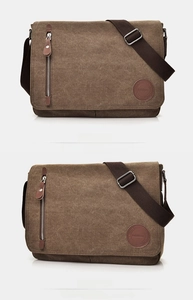 Detail view of coffee brown canvas messenger bag with leather logo and front zipper
