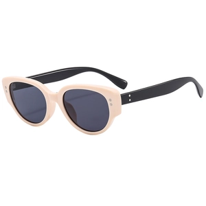 Fashionable cat eye sunglasses in cream and black with dark lenses for UV protection