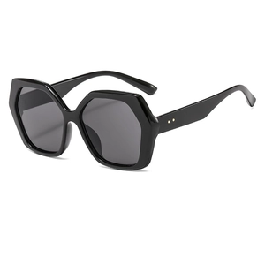 Fashionable oversized hexagonal sunglasses with black frames for outdoor street style