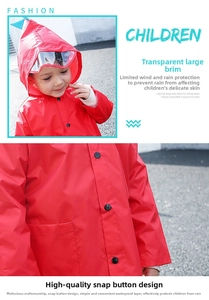 Detail of red children's raincoat with transparent brim and snap button closure