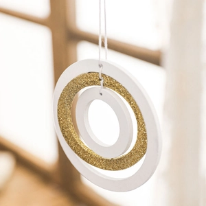 Nordic wooden star ornament with three concentric rings and gold glitter for Christmas tree