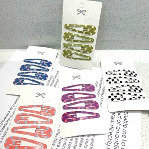 Polka dot teardrop hair clips in multiple colors for girls including green and purple