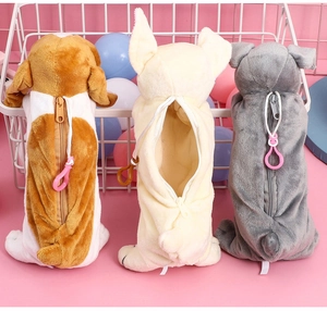 Detailed view of plush dog pencil cases with zippers and hooks on pink background