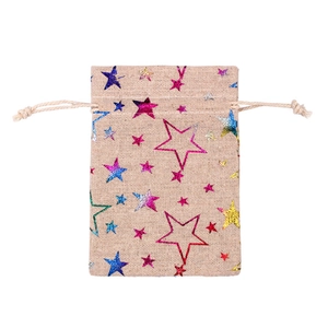 Detail of linen drawstring gift bag with colorful glitter stars and coarse texture
