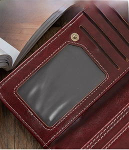 Detail view of brown vintage leather wallet with multiple card slots and ID window