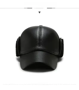 Detail view of winter baseball cap showing ear flaps and faux leather texture