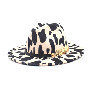 Cow print fedora hat with felt wide brim and black band with gold leaf buckle