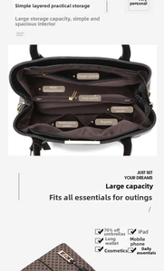 Detailed view of the organized multi-layer interior of a vintage print leather handbag
