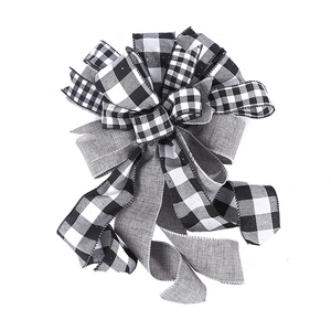 Christmas tree topper bow featuring black and white plaid and grey linen textured ribbons