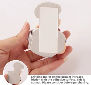 Macro detail of the chef plug holder back showing the adhesive tape and sanded resin base
