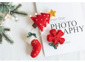 Handmade wool felt Christmas tree, stocking and flower ornaments for festive DIY decor