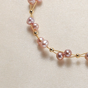 Pink baroque pearl bracelet with gold beads and delicate metal wire weaving for women