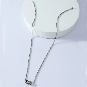 Silver stainless steel cylinder necklace featuring a hollow totem lucky bead design