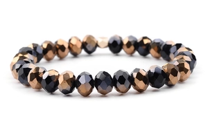 Detail shot of elastic beaded bracelet with faceted black and bronze crystal glass beads