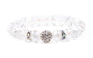 Macro view of faceted crystal beads and rhinestone-encrusted center ball on a stretch bracelet