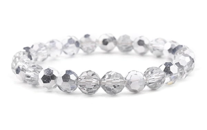 Macro view of crystal beaded bracelet with silver faceted glass beads on elastic cord