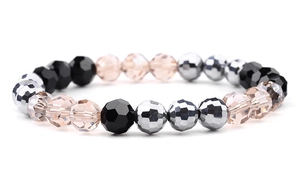 Close-up of sparkling faceted glass crystal beads in pink and black for elastic bracelet