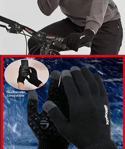 Detail of black knit winter gloves showing touchscreen fingertips and anti-slip palm grip