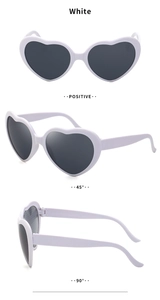 Three-angle view of white heart-shaped diffraction glasses with smoke lenses
