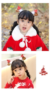 Close-up of cute Christmas reindeer antler hair clips worn by a girl in festive red outfit