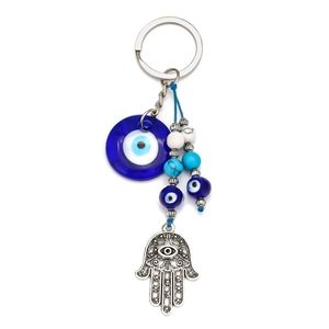 Detailed close-up of blue evil eye and Hamsa Hand keychain with bead accents
