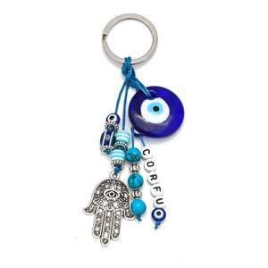 Detail of blue evil eye keychain with Hamsa hand and Corfu letter beads accessory