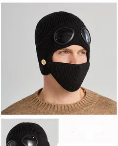 Close-up of knit aviator hat with integrated goggles and a matching black face mask