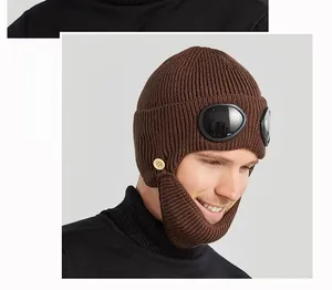 Detail view of the brown aviator knit hat with goggles and a detachable face mask