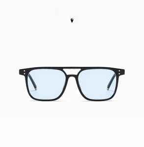 Macro view of retro square pilot sunglasses with black frame and light blue lenses