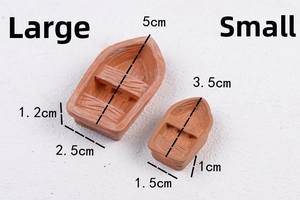Detailed view of two resin miniature boats with wood texture for micro landscapes