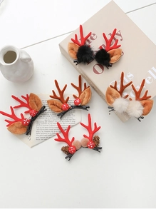 Close-up of assorted Christmas reindeer antler hair clips with plush balls and pine cones