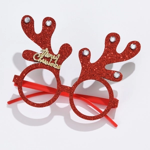 Detail of red glitter reindeer antler glasses with golden Merry Christmas text and rhinestones