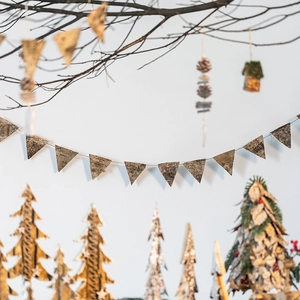 Rustic Christmas decor set featuring natural birch bark triangle banners and pinecones