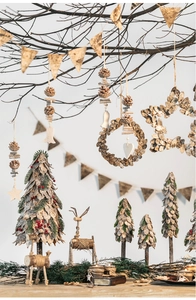 Detail of forest style Christmas ornaments made of natural birch bark and pine cones