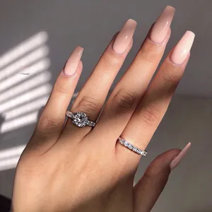 Close-up of sparkling 925 sterling silver couple rings set with high quality cubic zirconia