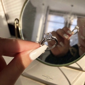 Macro shot of 925 sterling silver ring with large round zircon in four-prong setting