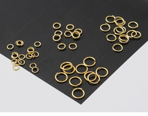 Detailed view of assorted 18K gold-plated jump rings for DIY jewelry making and crafts