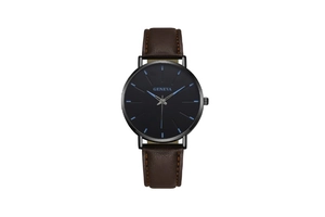 Close-up of black matte watch dial with blue indexes and brown leather strap detailing