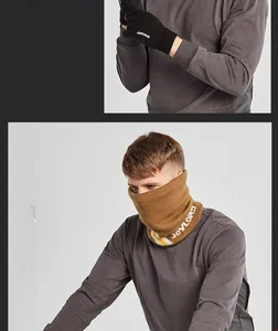 Close-up of knit winter set featuring black thermal gloves and yellow neck gaiter