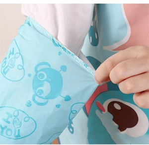Close-up of waterproof light blue sleeves with cartoon prints and elastic cuffs