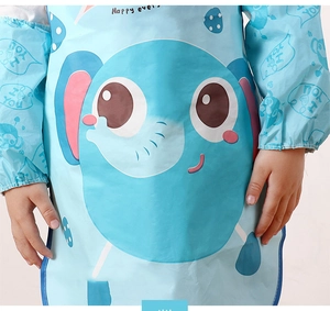 Detail of waterproof toddler apron featuring a blue elephant print and sleeve protection
