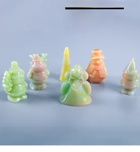Macro view of 3D Christmas resin dolls including reindeer and Santa for DIY crafts