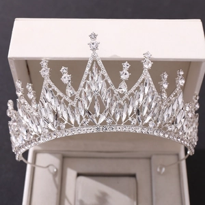 Exquisite white crystal bridal tiara in a premium jewelry box with shimmering rhinestones