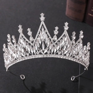 Detailed close-up of a silver Baroque bridal crown with brilliant white crystals