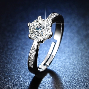 Adjustable silver six-prong ring featuring a large solitaire stone with pave side accents